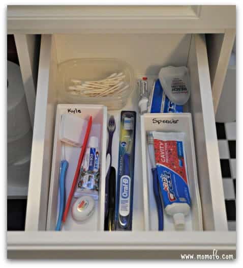 https://www.momof6.com/wp-content/uploads/2014/10/Tips-for-a-Shared-Bathroom-toothbrush-storage.jpg
